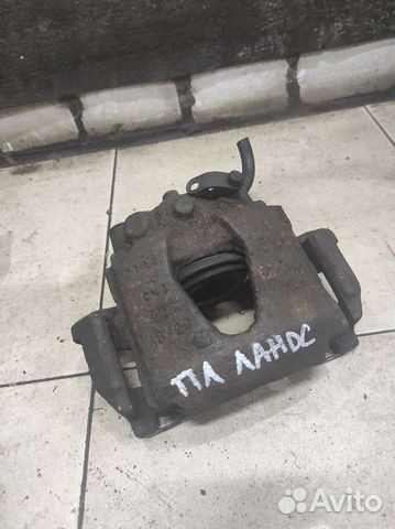 Передний левый суппорт Chevrolet Lanos